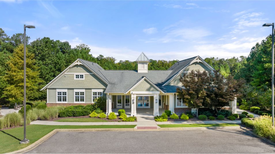 Stonehouse Residents Center clubhouse surrounded by trees and landscaping